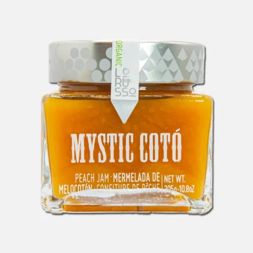 Tarro de miel Mystic Cotó, con tapa plateada y etiqueta blanca, destacando su textura dorada y propiedades naturales. Ideal para endulzar y enriquecer recetas.