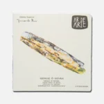 Caja de arte con diseño colorido que muestra un producto de la marca "Arte de Arte". Incluye información sobre el tipo de material y su uso en manualidades.
