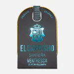Lata de ventresca de atún "El Capricho" de Santora, con un diseño elegante en tonos oscuros y detalles en azul. Ideal para amantes de la gastronomía gourmet.