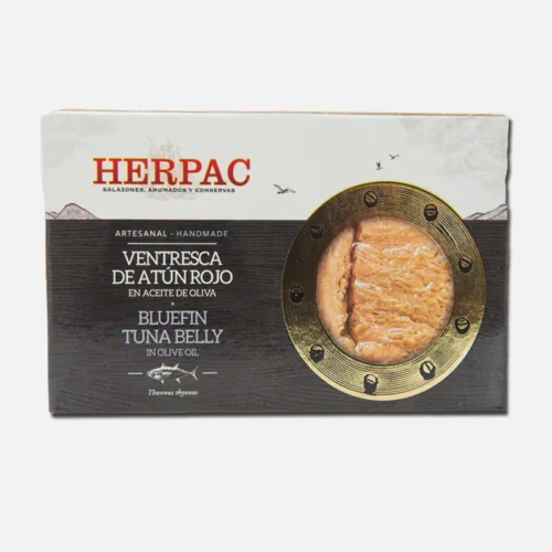 Lata de ventresca de atún rojo de la marca Herpac, destacando su textura y color. Ideal para ensaladas y platos gourmet.